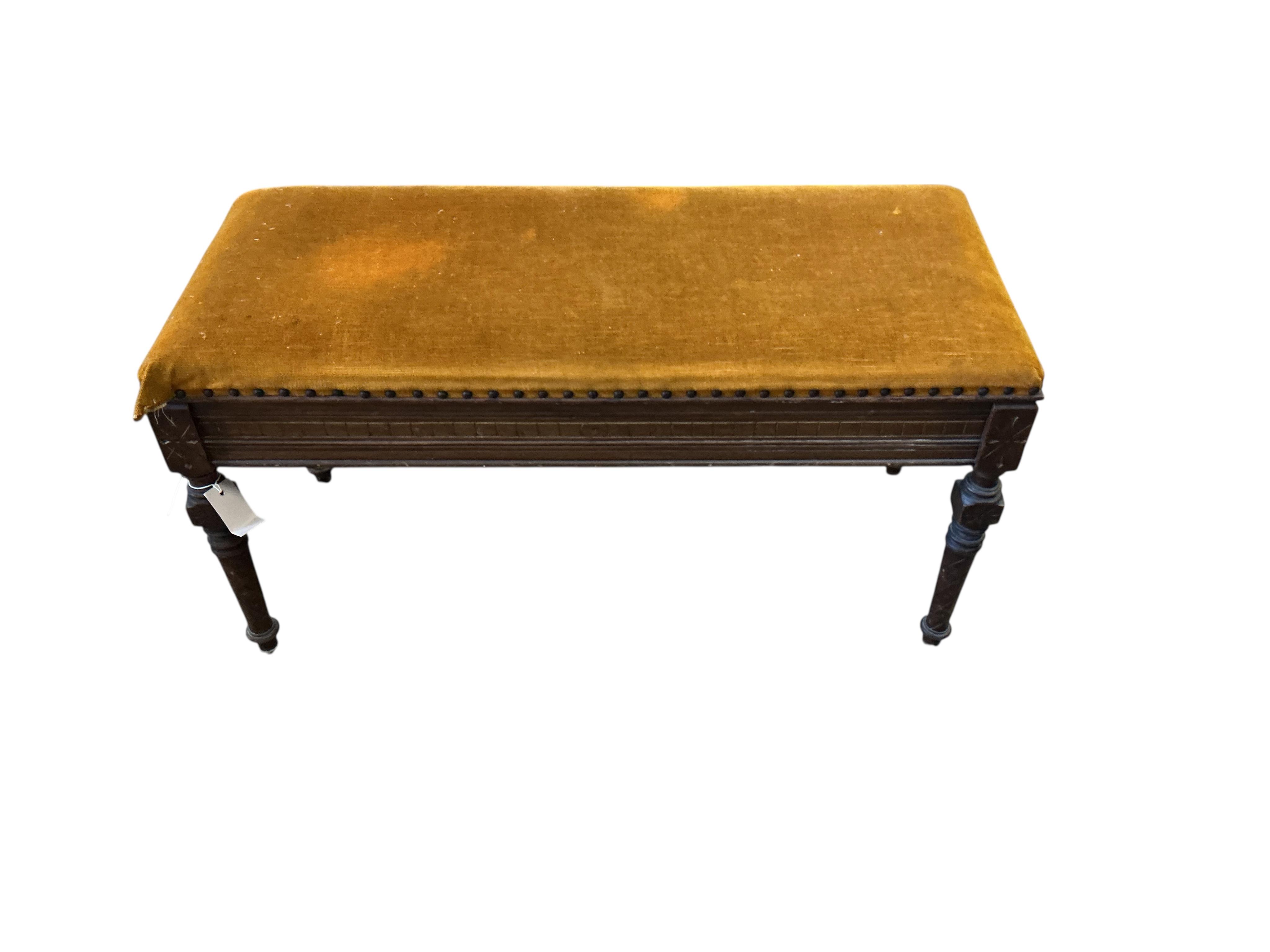 A late Victorian mahogany Aesthetic movement box seat duet piano stool, width 92cm, depth 38cm, height 47cm